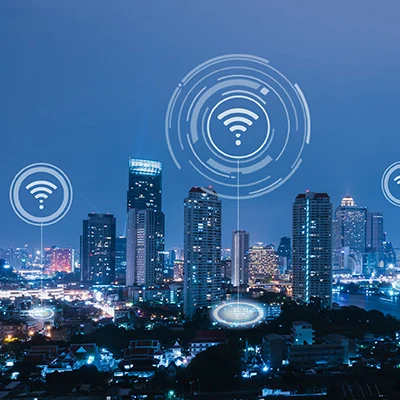 A selection of wireless icons above a cityscape.