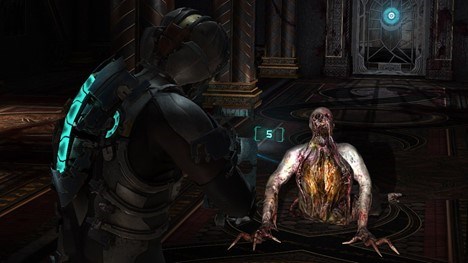 Dead Space 2 screenshot showing creature crawling and main character aiming weapon