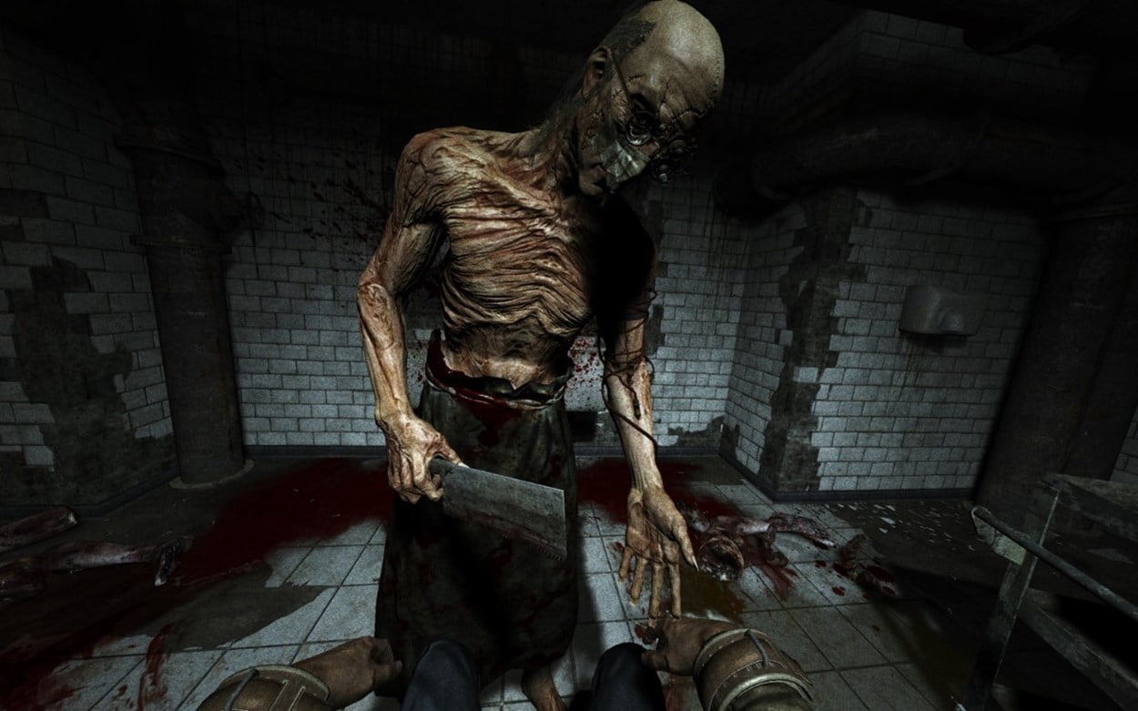 Outlast screenshot showing eviscerated creature with a cleaver