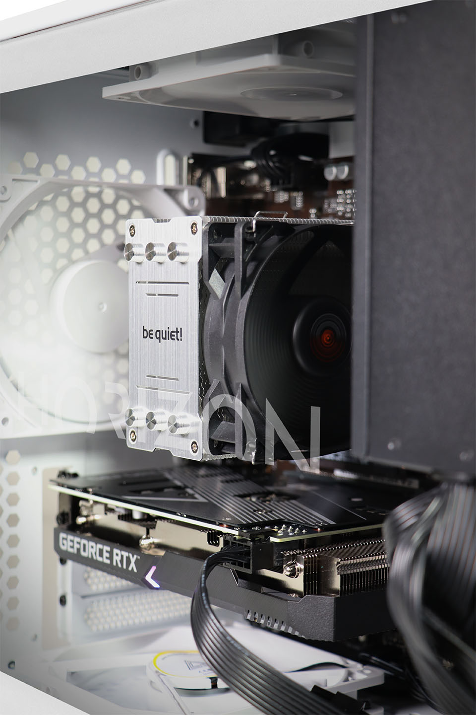 The inside of the PC, showing the CPU area and rear fan