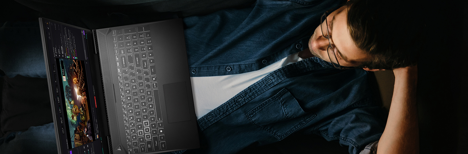 View from above of a man lounging on a couch whilst using a Horizon Skyline laptop