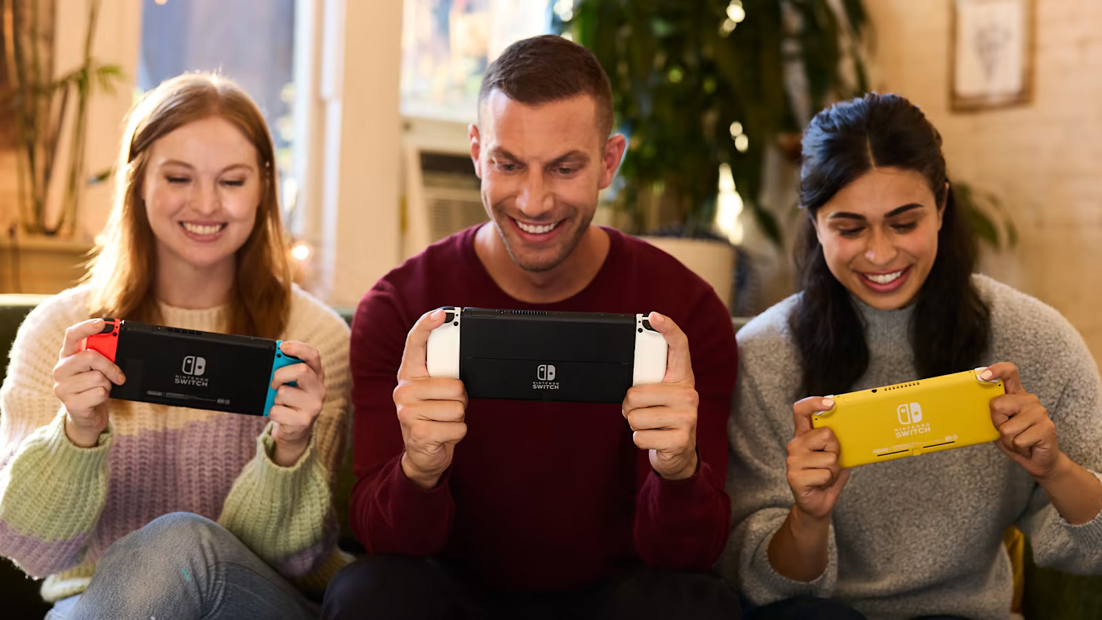 Three friends playing on all three models of Nintendo Switch.