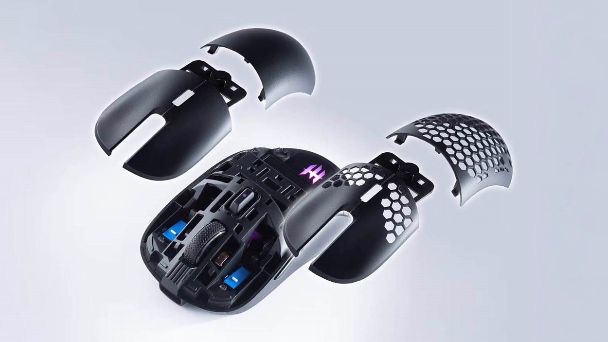 Exploded view of the Tecware Pulse Elite gaming mouse showing interchangeable magnetic top shells, including solid and honeycomb designs for customizable weight and airflow.