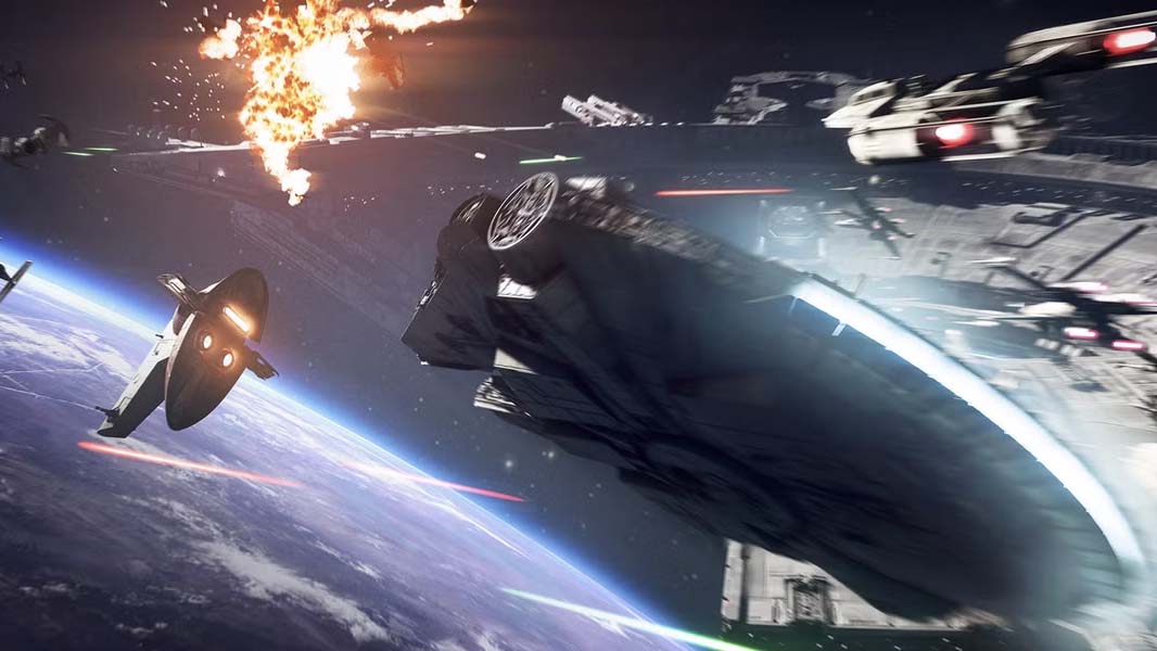 The Millennium Falcon leads a fleet of starfighters in a space battle above a planet in Star Wars Battlefront II, with laser fire, explosions, and a massive Star Destroyer in the background.
