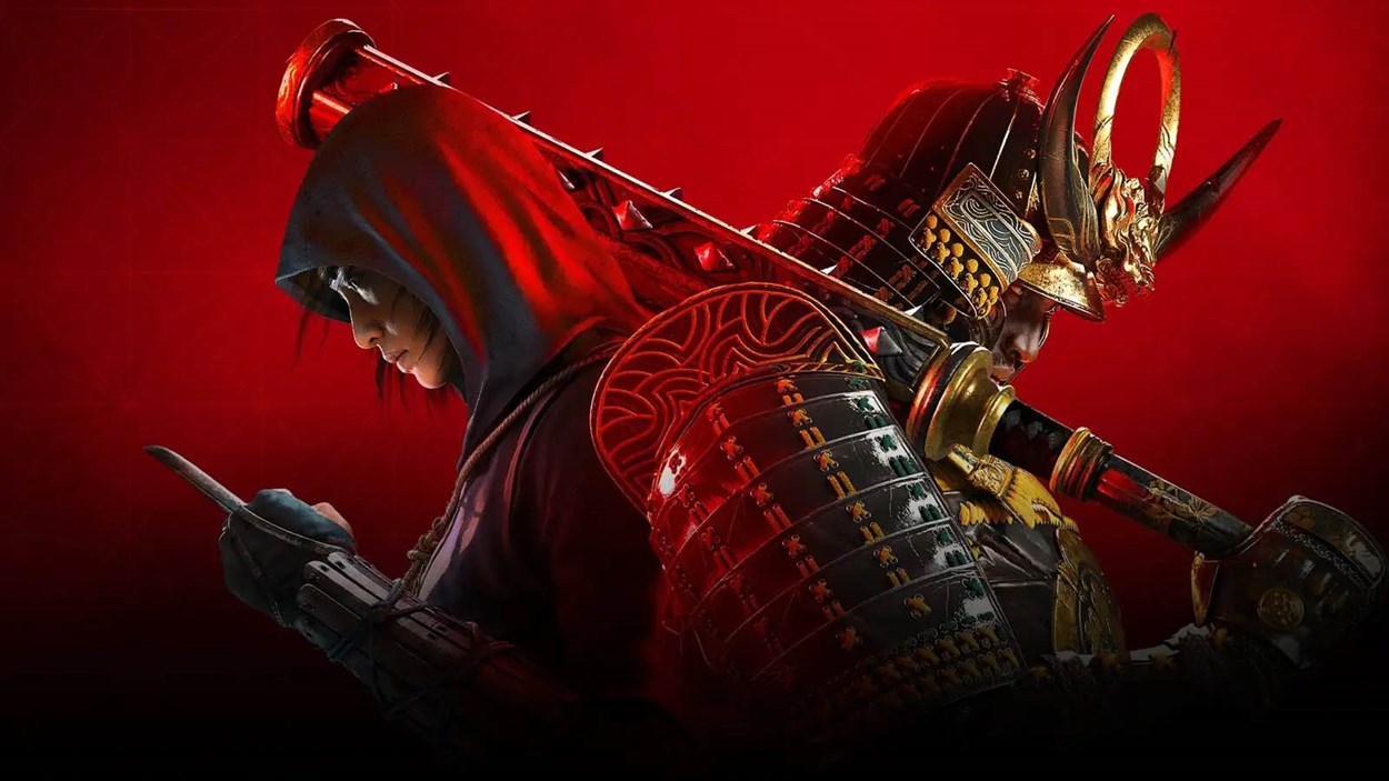 A dramatic promotional image for Assassin’s Creed Shadows, featuring two protagonists back-to-back. On the left, a hooded shinobi wields a kunai, emphasizing stealth and precision. On the right, a heavily armored samurai grips a katana, symbolizing strength and honor. The intense red background enhances the contrast between the two warriors, highlighting the duality of their fighting styles and the game's feudal Japan setting.