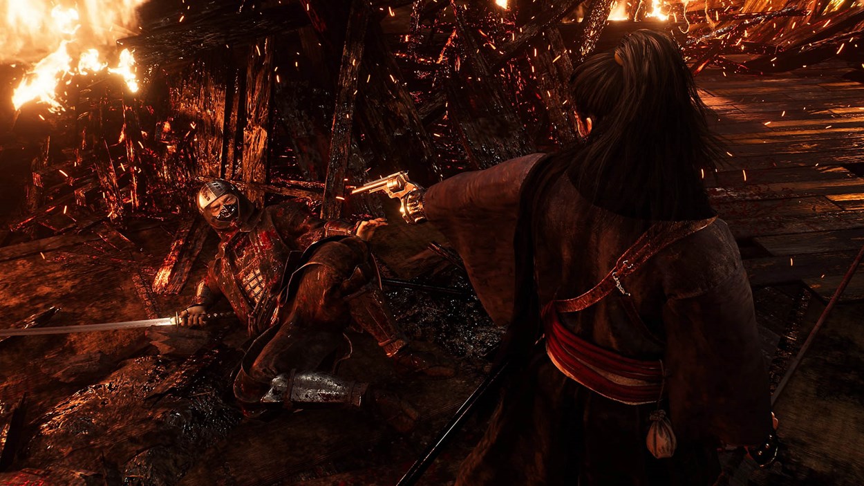 A warrior in traditional Japanese attire aims a revolver at a wounded, armored samurai lying on the burning remains of a battlefield. The defeated samurai, gripping a bloodied katana, reaches out in desperation as flames and embers engulf the wooden structure around them. The scene is intense and dramatic, showcasing the fusion of sword combat and gunplay in Rise of the Ronin.