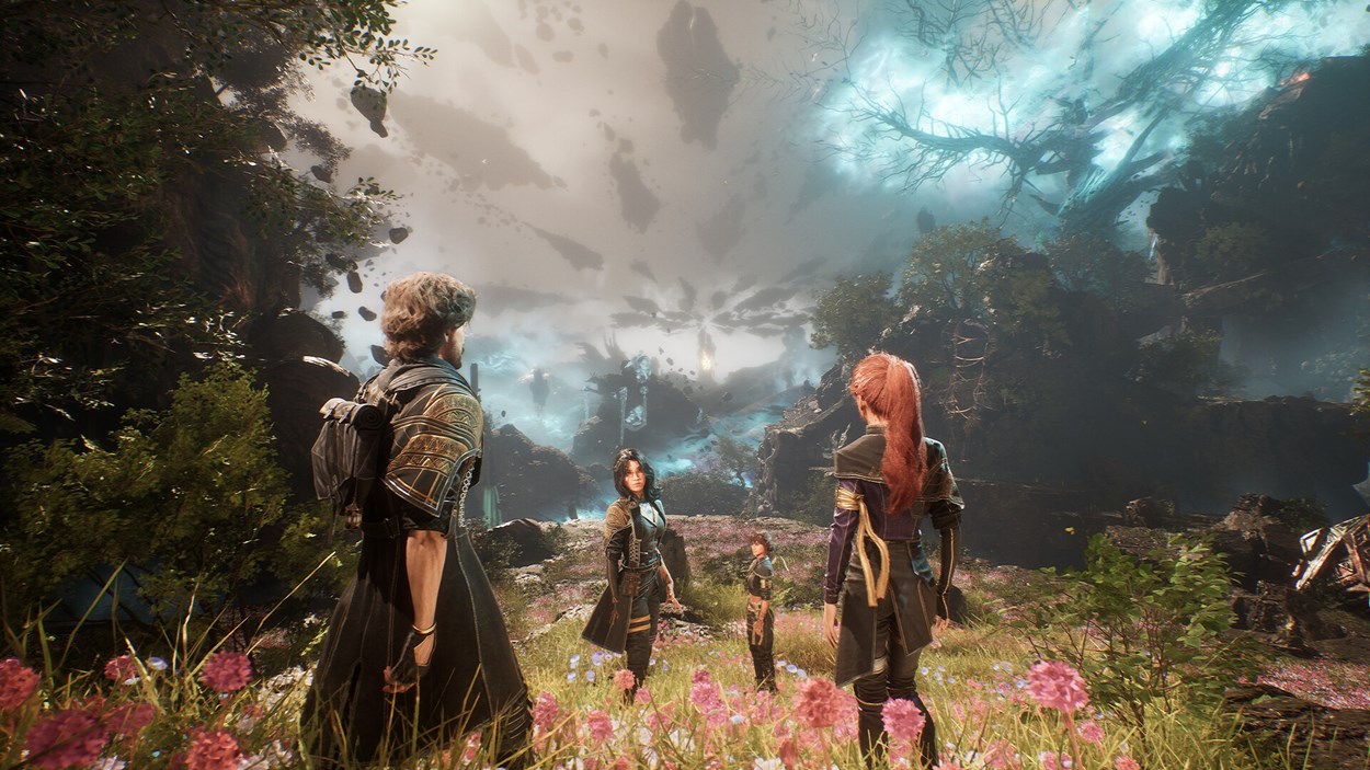 Four characters stand in a vibrant, flower-filled meadow surrounded by ancient ruins and glowing, otherworldly skies as they gaze toward a distant, mysterious horizon in Clair Obscur: Expedition 33.