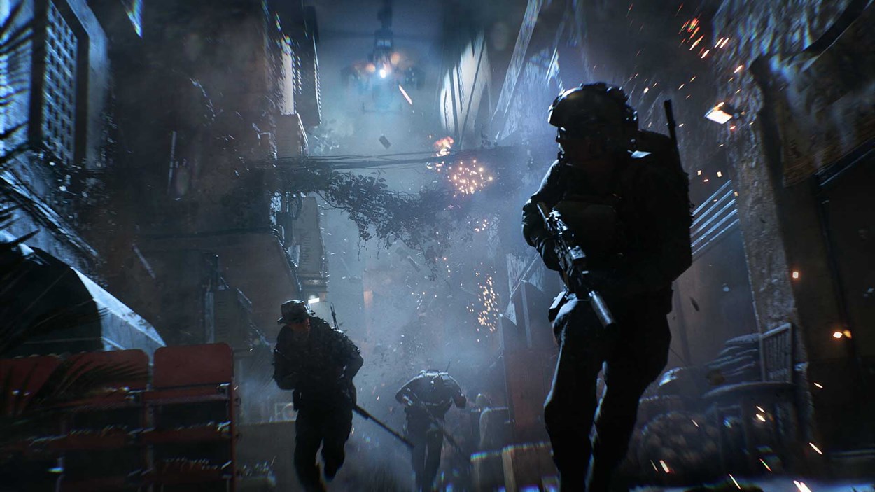 Armed soldiers sprint through a narrow, dimly lit alleyway as explosions and debris erupt around them during an intense urban firefight.