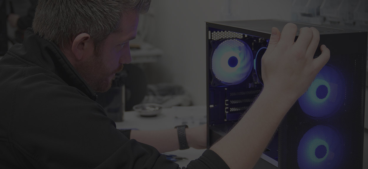 One of our build technicians inspecting a gaming PC they're building.