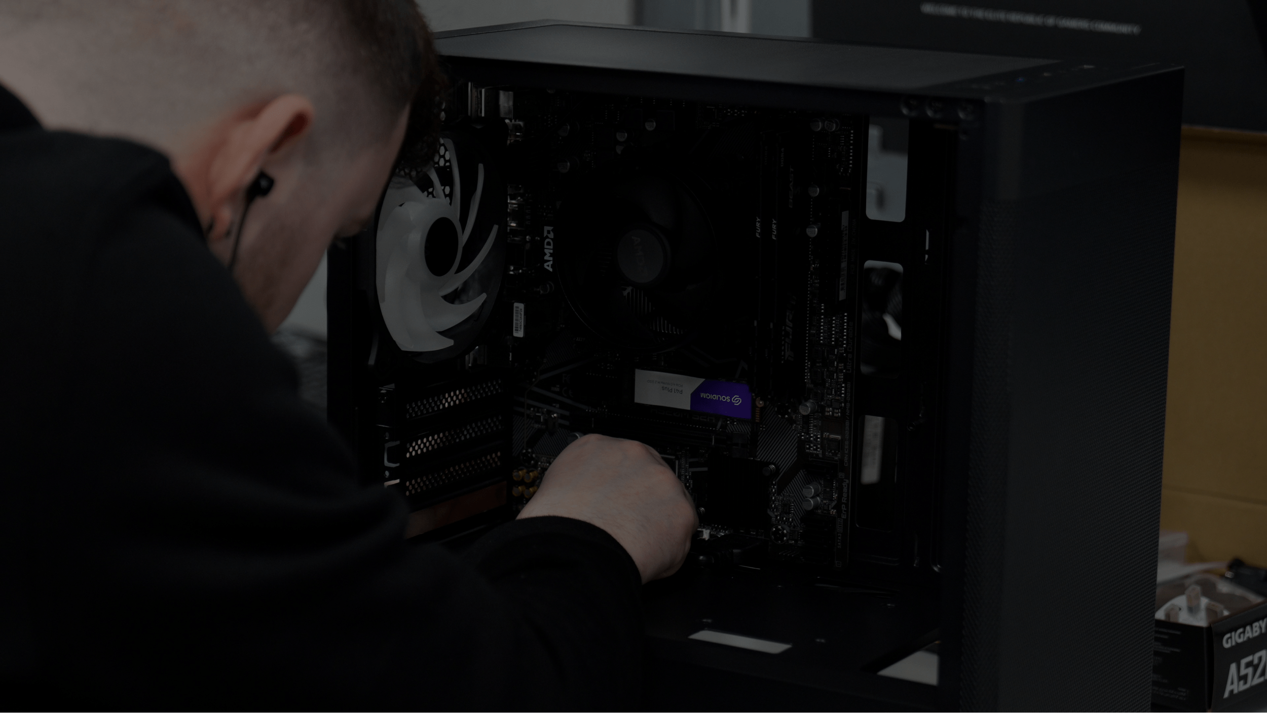 One of our build technicians inspecting a gaming PC they're building.